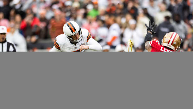 Oct 15, 2023; Cleveland, Ohio, USA; Cleveland Browns place kicker Dustin Hopkins (7) kicks a 29-yard field goal as San Francisco 49ers cornerback Deommodore Lenoir (2) dives to block it during the fourth quarter at Cleveland Browns Stadium. The field goal was good and gave the Browns the lead in the closing minutes of the game. 